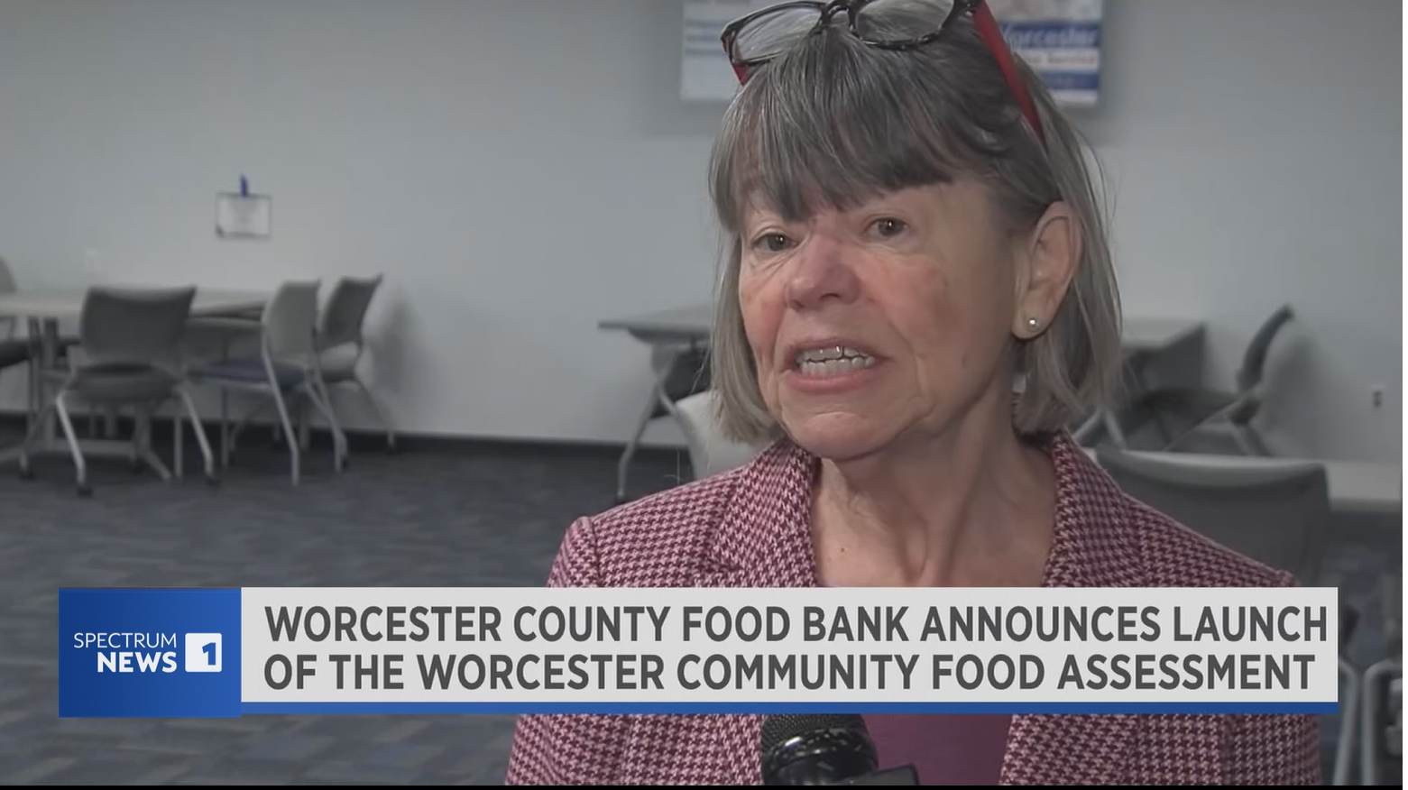 screenshot of Spectrum news coverage of Community Food Assessment launch. Image shows Worcester County Food Bank Director Jean McMurray addressing food insecurity